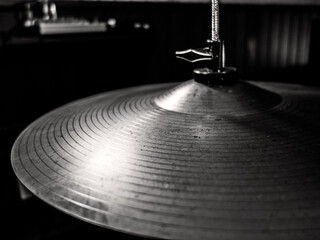 Close-up of a drum hi-hat in black and white