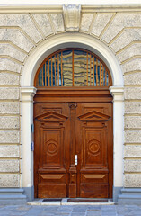 Old closed wooden door on street