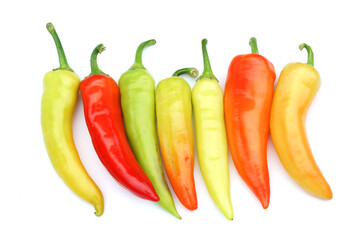 close up on fresh colorful peppers isolated on white background