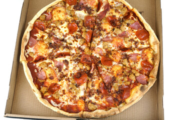 high angle view on fresh baked pizza in the box