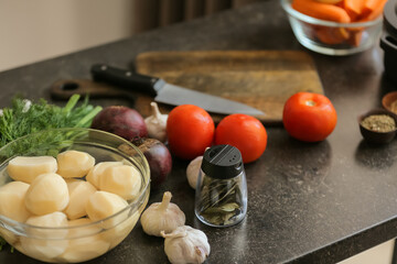 Ingredients for preparing tasty borscht on black table in kitchen