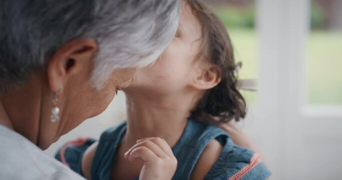 happy little girl gently kissing grandmother on forehead cute child showing love for granny 4k