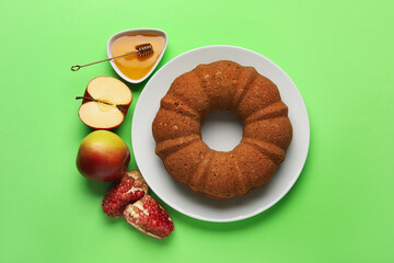 Bread with honey, pomegranate and apples on color background. Rosh hashanah (Jewish New Year) celebration