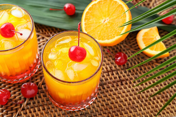 Glasses of tasty Tequila Sunrise cocktail on table