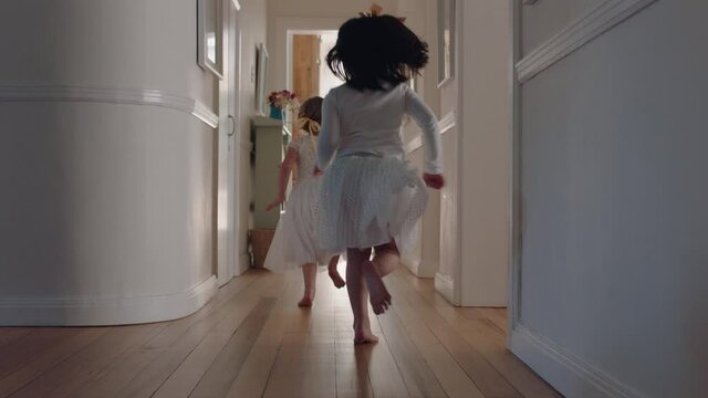 happy little girls running through house wearing tutu excited to go outside playful children enjoying childhood fun on weekend morning 4k