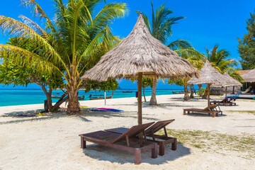 Parasol, sunbed on beach