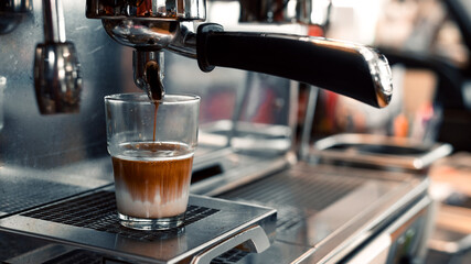 black coffee with milk on coffee maker