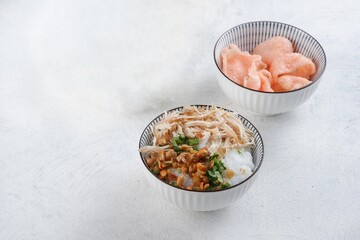 Bubur ayam, Indonesian rice porridge served with shredded chicken - obrazy, fototapety, plakaty