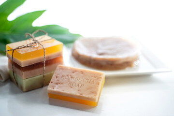 Handmade Kombucha natural soap, stack of soap bars and Kombucha mushroom pro biotic on plate, Kombucha SCOBY 
