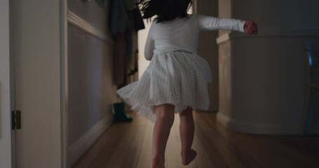 beautiful little girl running through house jumping on bed holding teddy bear having fun child in playful mood enjoying weekend morning at home - Powered by Adobe