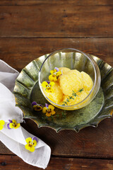 Sorbet nanas. Homemade fresh fruit pineapple sorbet ice cream, topping with edible flowers.