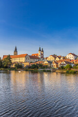 Fototapeta na wymiar Castle and houses at the lake in Telc, Czech Republic