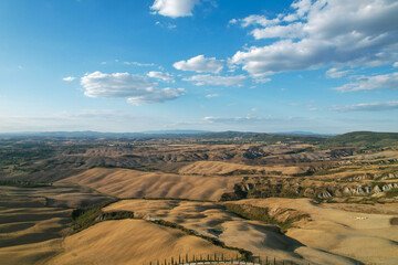  Beautiful idyllic late summer landscape of Toscana with photographed with drone. Sunny day in Italy. Vacation, recreation mood. Agricultural fields of Tuscany 