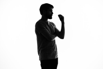 a man in the shadows gesturing with his hands anonymity studio incognito