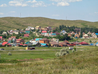 Obraz premium One of the districts of the city of Ust-Kamenogorsk (kazakhstan). City outskirts. Cottages. Summer steppe