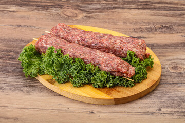 Raw minced beef kebab skewer