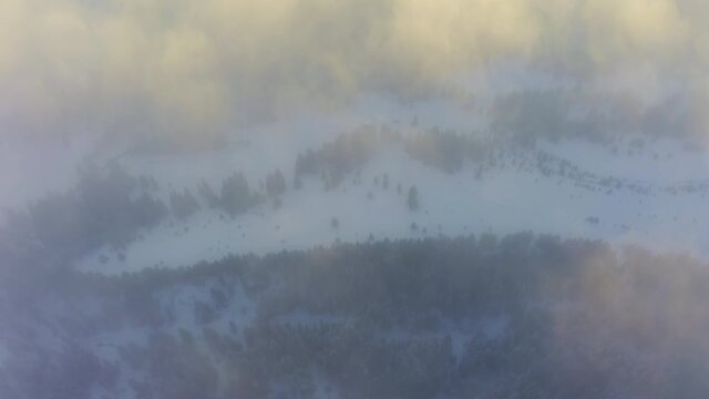 Wonderful view of extraordinary cloudy valley and bright orange sunset