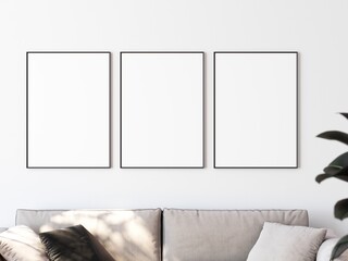 Row of three picture frames hanging on white wall above sofa. Place for your content. 3D illustration.