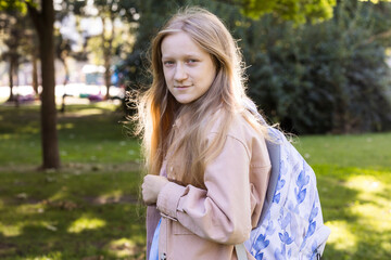 Fototapeta premium beautiful schoolgirl with a backpack