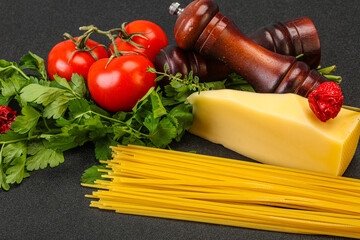Raw Italian spaghetti heap with cheese