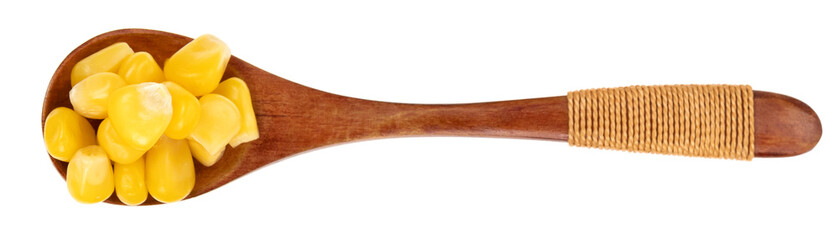 Wooden spoon with raw corn seeds isolated on white background. Raw fresh corn close up.