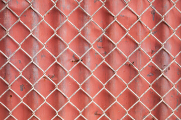 Wire Mesh and red corrugated fence