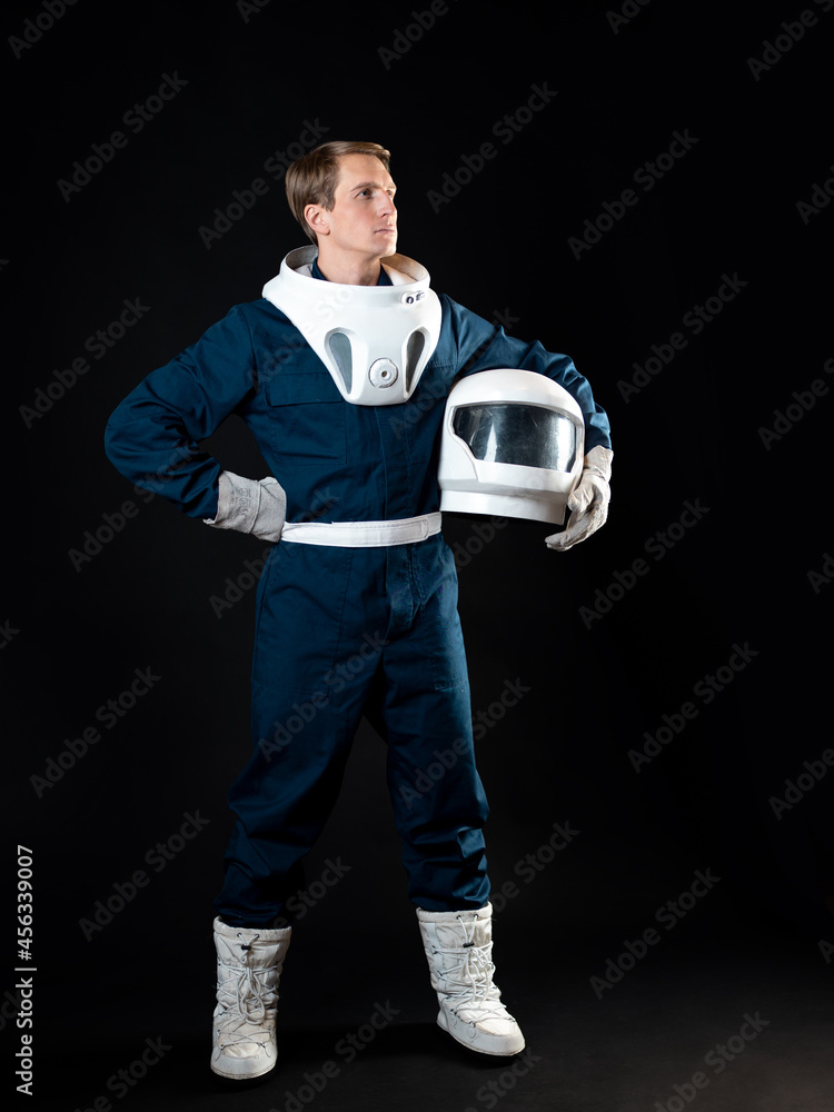 Wall mural an astronaut in a spacesuit is ready for launch.