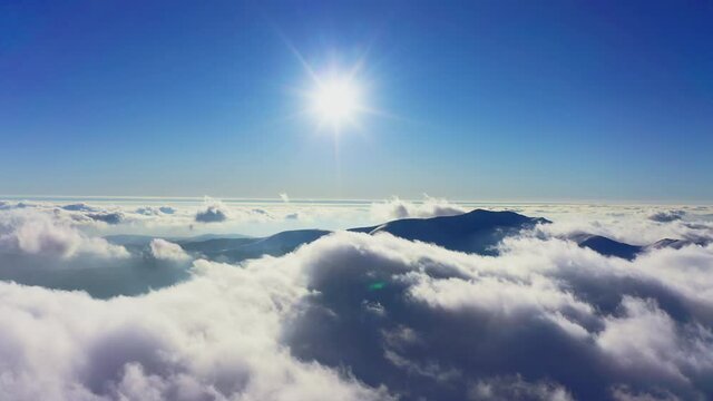 Wonderful view of extraordinary cloudy valley and bright orange sunset
