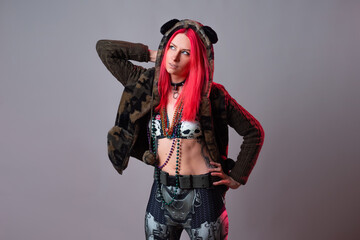 Futuristic fashion, a young bright and attractive woman with pink hair,