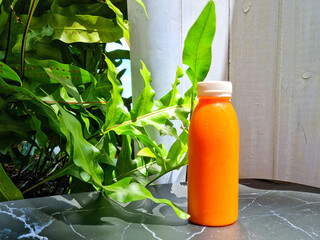 Cold pressed juice in a plastic bottle.