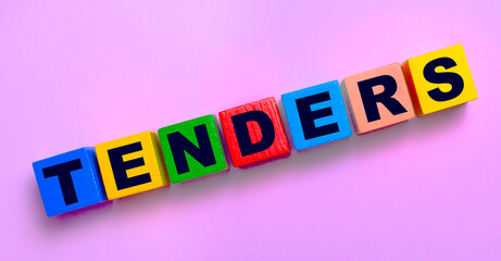 On a light pink background, multi-colored wooden cubes with the text TENDERS