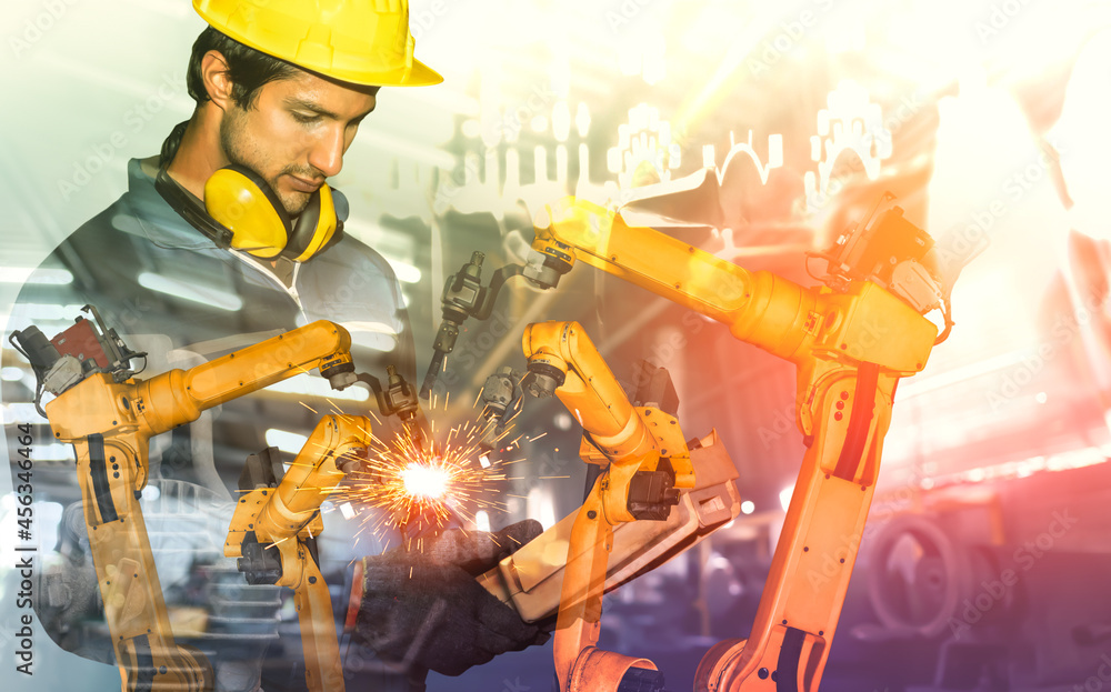 Poster mechanized industry robot arm and factory worker double exposure . concept of robotics technology fo