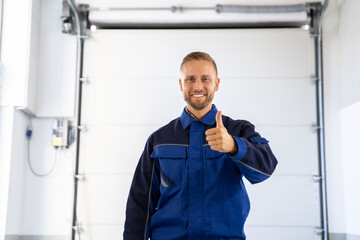 Garage Door Installation And Repair At Home. Contractor Man