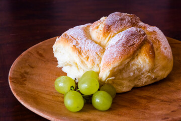 Housemade sweet cone with green grape on a platter