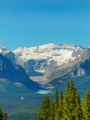 Canadian landscape with snow-capped mountains, blue lake and forest | Lake Louise, Canada