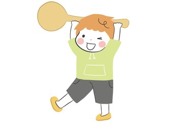 給食を楽しみに大きなスプーンを運ぶかわいい男の子
