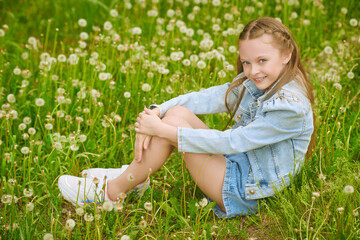 child with dandelions