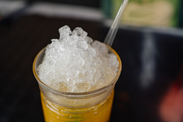 crushed ice in a glass of lemonade. serving soft drinks