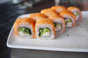 a set of Philadelphia rolls on a white plate. Japanese cuisine. 