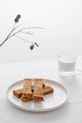 Morning Breakfast set with bread toast and milk in glass.
