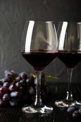Red wine in a glass and grapes