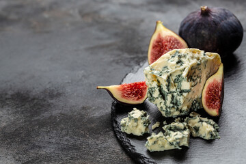 piece of italian blue cheese gorgonzola with blue mold. Long banner format. top view