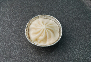 handmade steamed Shanghai Xiao long bao pork meat dumpling soup on dark grey wood background dim sum menu