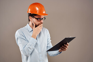 male engineer documents in hand and drawings success isolated background