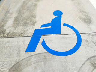 Handicap parking space in a parking lot. Handicapped parking spot symbol in factory