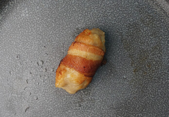deep fried pork meatball wrapped with bacon roll on dark grey wood background dim sum menu