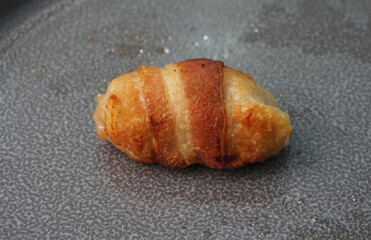 deep fried pork meatball wrapped with bacon roll on dark grey wood background dim sum menu