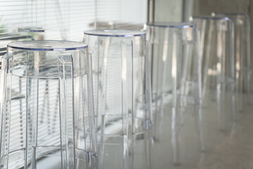 Set of the row transparent chairs on ceramic floor decoration for home architecture building contemporary.