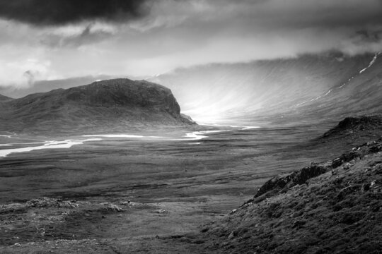 Black and white picture of arctic landscape in extremely rough weather in Stora Sjofallet national park, Swedish Lapland. Heavy rain and dramatic clouds.