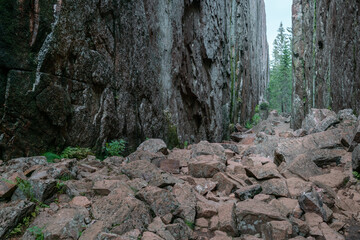 Slattdalsskrevan Canyon in Skuleskogen National Park, Sweden. Narrow crevasse in solid rock on a cloudy summer day. Hiking along the High Coast Trail in Sweden. Hohe Kustenleden trail.